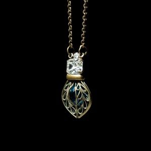 Blue filigree Sorrelli pendant in Antique Gold